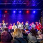 Innovations singing Christmas Carols on the Main Stage