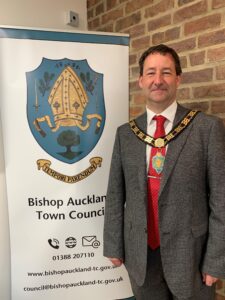 Deputy Mayor of Bishop Auckland, Councillor Michael Siddle with Town Council Banner.