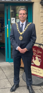 Mayor of Bishop Auckland, Councillor Sam Zair outside of The Four Clocks Centre.
