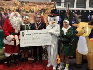 Mayor Sam Zair with Santa and his Elves at Auckland Youth and Community Centres' (AYCC) Winter Wonderland.