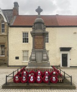Poppy Wreaths on War Memorial, Bishop Auckland Market Place (2025).