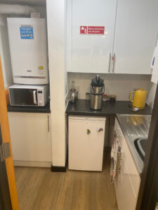Kitchenette on the ground floor with sink, kettle, fridge and microwave facilities.