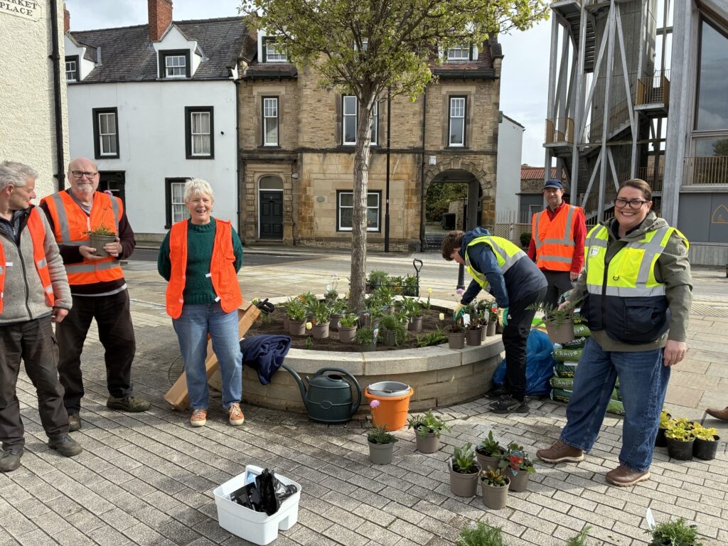 Sarah Harris, Town Clerk (right) with Volunteers at the Community Planting event in Bishop Auckland Market Place.